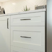 White cabinet with black and slim handle